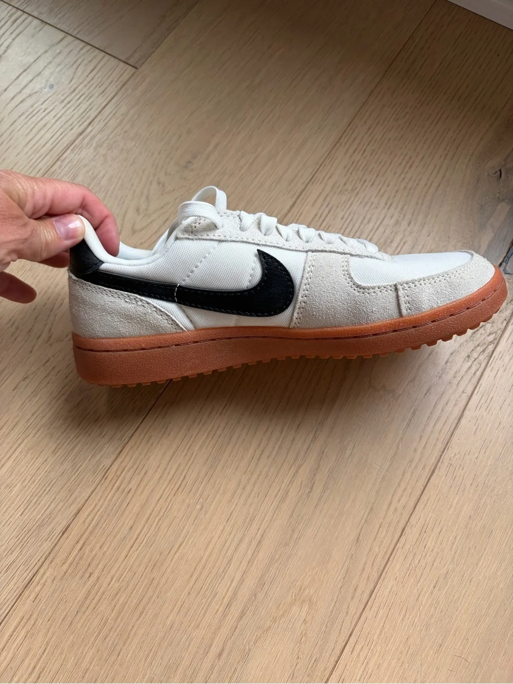 Nike Women’s White Sneakers with Brown Outsole and Black Swoosh